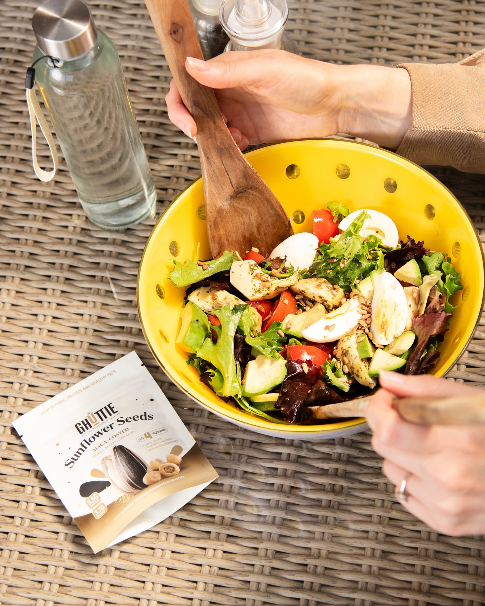 Lifestyle photo of Ghuttie Maca Sunflower Seeds pouch in use