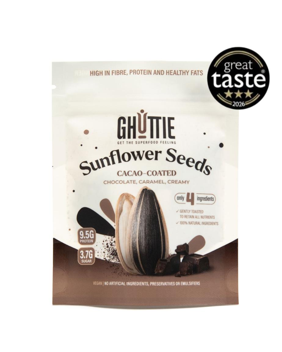 A stand-up pouch of Ghuttie Sunflower Seeds on a plain white background, with a black circular 'great taste 2025' badge in the top right corner. The packaging is cream and brown with an illustration of a sunflower and chocolate pieces.