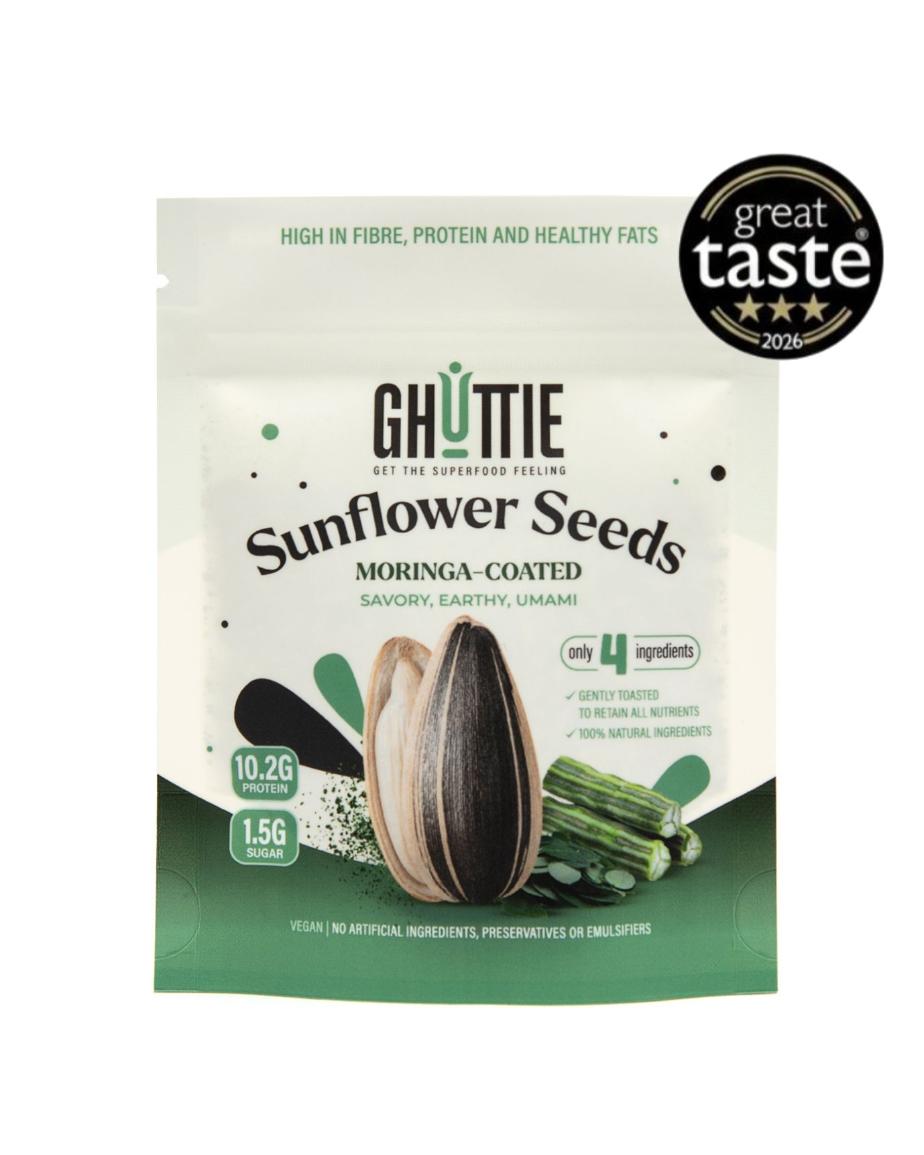 A stand-up pouch of Ghuttie Sunflower Seeds, Moringa-Coated, on a plain white background with a black 'great taste 2025' badge in the top right corner. The packaging is primarily white and green with illustrations of a sunflower and green sprouts.